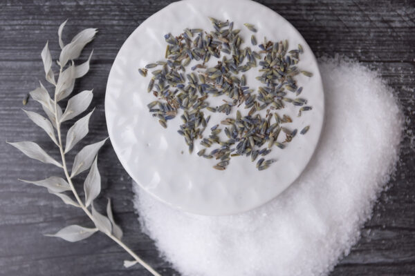 lavender and bath salts decoratively displayed on a plate