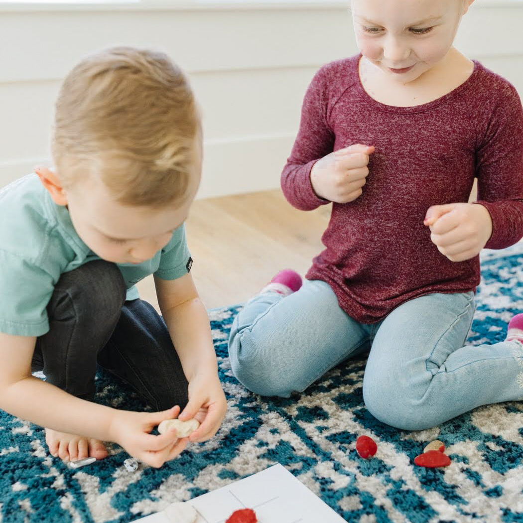 kids playing a game from an activity kit
